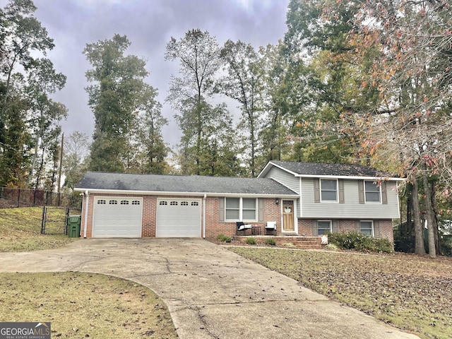 split level home featuring a garage and a front yard