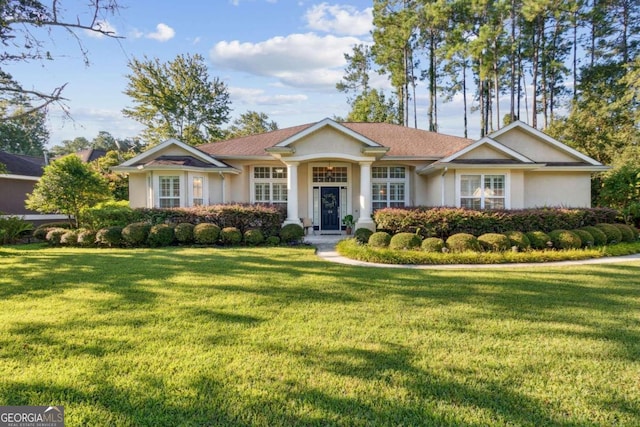 single story home featuring a front lawn