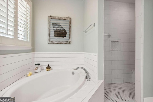 bathroom featuring separate shower and tub