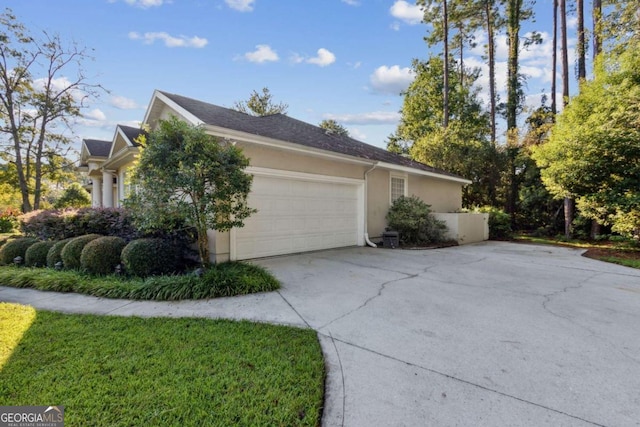 view of side of property with a garage