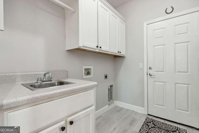 washroom with cabinets, washer hookup, sink, and electric dryer hookup