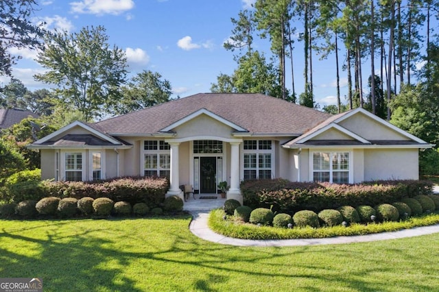 single story home featuring a front lawn