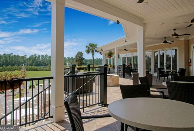 view of patio featuring ceiling fan