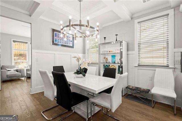 dining space with beamed ceiling, coffered ceiling, hardwood / wood-style flooring, and crown molding