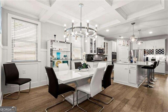 dining room featuring plenty of natural light, coffered ceiling, and dark hardwood / wood-style flooring