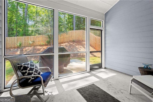 sunroom / solarium with vaulted ceiling