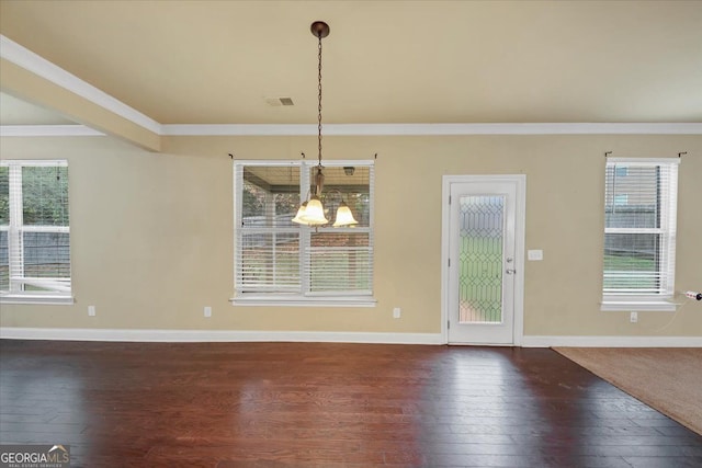 unfurnished dining area featuring ornamental molding and dark wood-type flooring