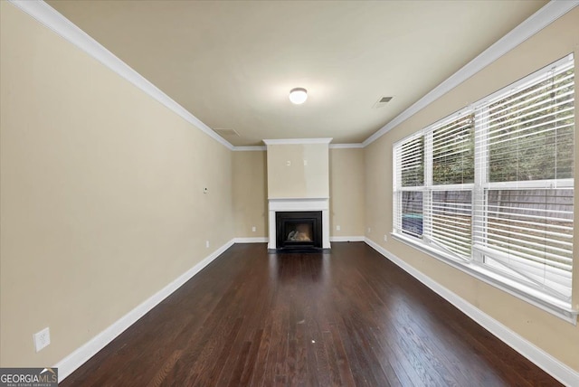 unfurnished living room featuring dark hardwood / wood-style flooring and crown molding