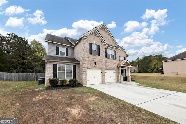 craftsman house featuring central AC unit, a garage, and a front yard