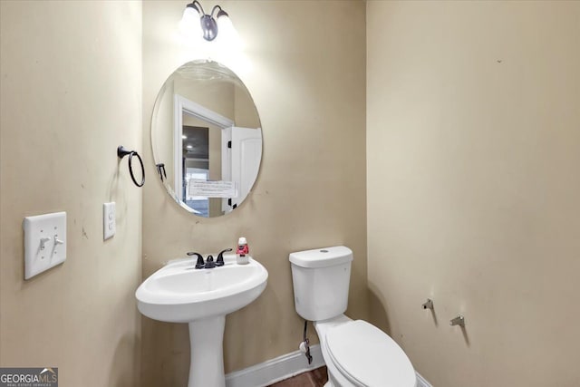 bathroom with toilet and sink