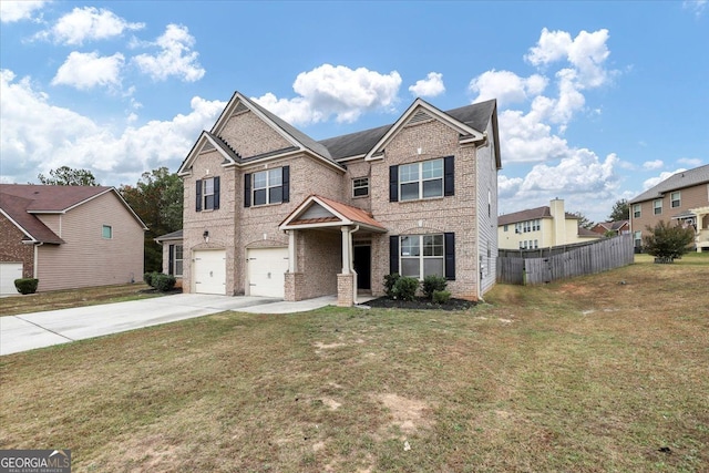 view of front facade featuring a front lawn and a garage