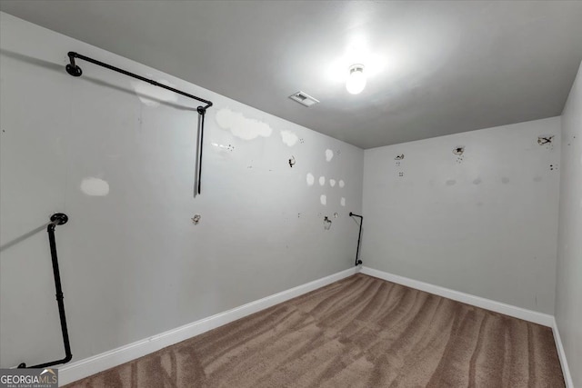 unfurnished room featuring carpet flooring