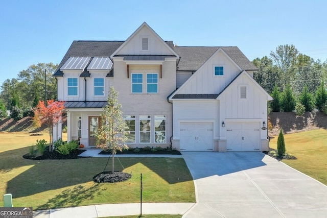 view of front of property with a garage and a front lawn