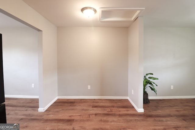 spare room featuring dark hardwood / wood-style flooring