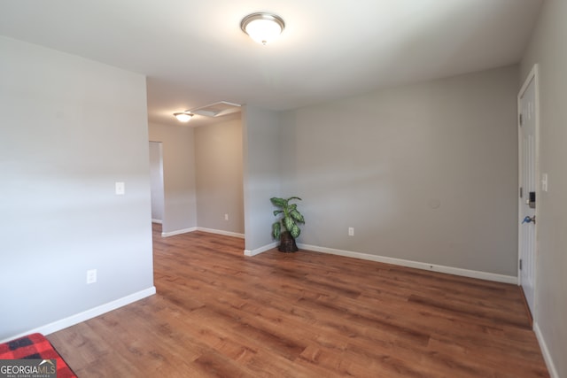 empty room with dark wood-type flooring