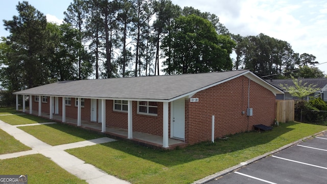 view of side of home featuring a lawn