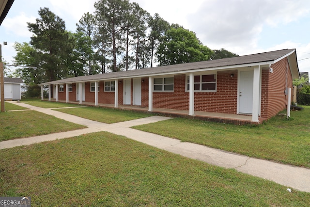 ranch-style home with a front lawn