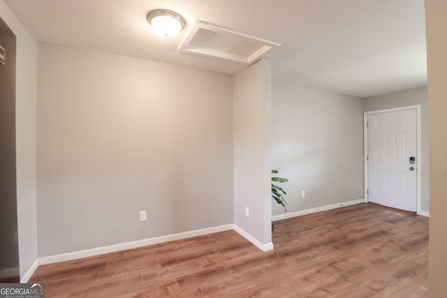 empty room with wood-type flooring