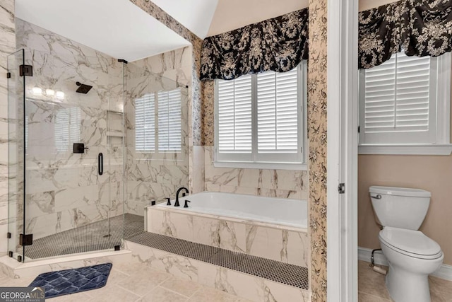 bathroom featuring toilet, tile patterned floors, shower with separate bathtub, and lofted ceiling