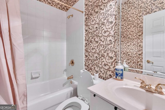 full bathroom featuring shower / tub combo with curtain, vanity, and toilet