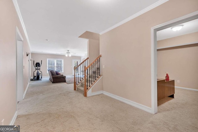 hall featuring light carpet and ornamental molding