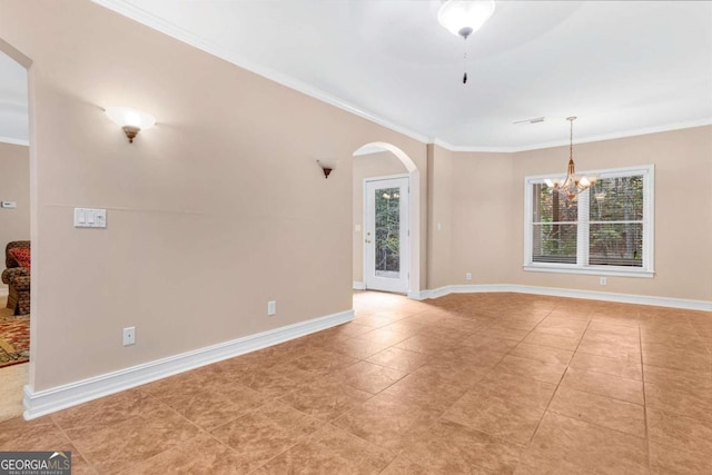 unfurnished room with a healthy amount of sunlight and ornamental molding