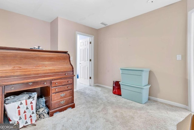 miscellaneous room featuring light colored carpet