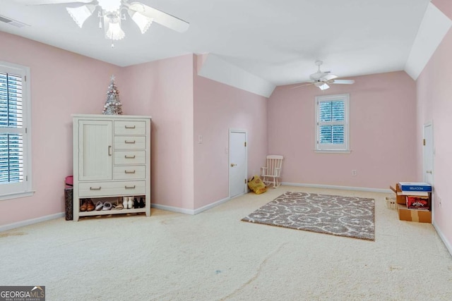 rec room featuring lofted ceiling, ceiling fan, and light carpet