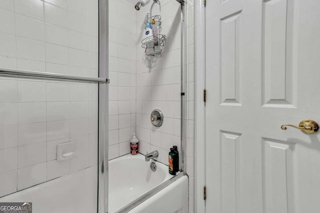 bathroom featuring tiled shower / bath