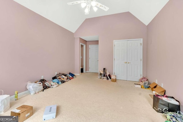 playroom featuring carpet, vaulted ceiling, and ceiling fan