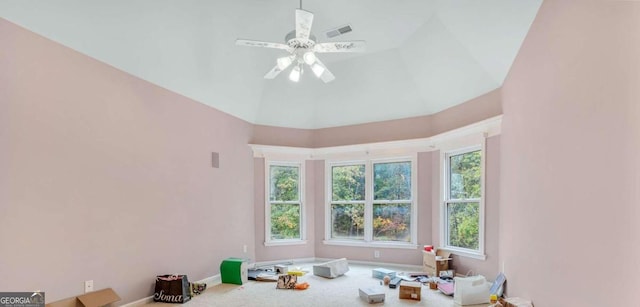 interior space with lofted ceiling and ceiling fan