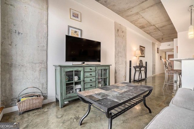 living room with concrete floors