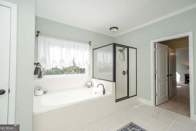 bathroom with tile patterned floors, ornamental molding, and shower with separate bathtub