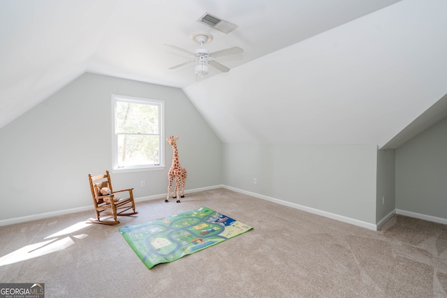 additional living space featuring light carpet, vaulted ceiling, and ceiling fan