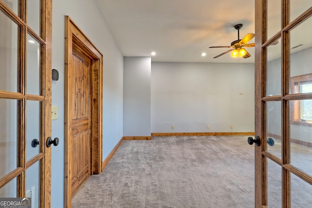 carpeted spare room with french doors