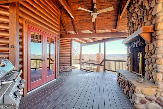 deck with a mountain view and ceiling fan