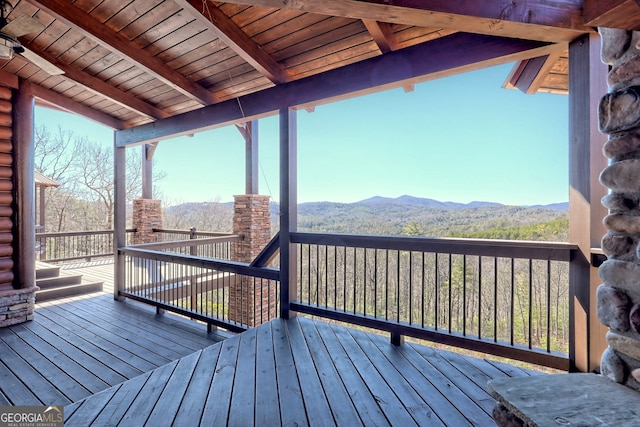 wooden deck with a mountain view