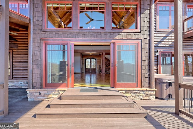 property entrance featuring a wooden deck