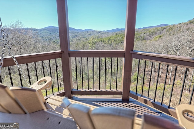 wooden deck featuring a mountain view