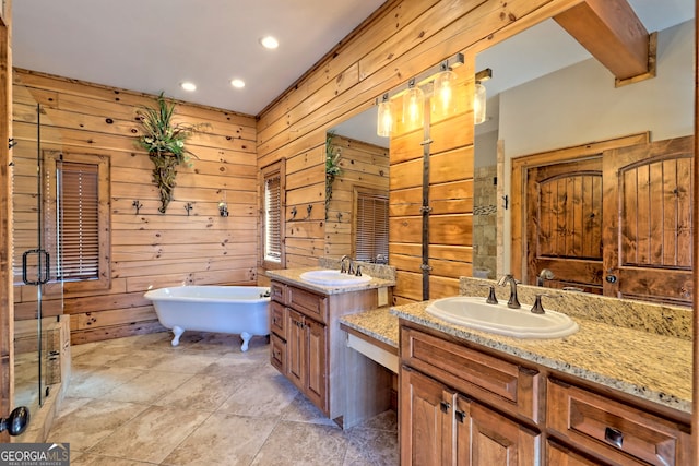 bathroom featuring wood walls, plus walk in shower, and vanity