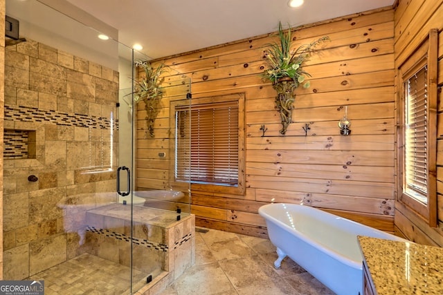 bathroom featuring wood walls and separate shower and tub