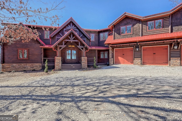 view of front of property with a garage and covered porch