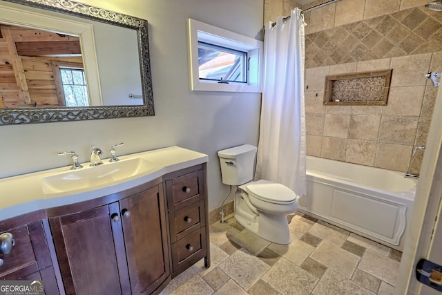 full bathroom with vanity, shower / bath combo, and toilet