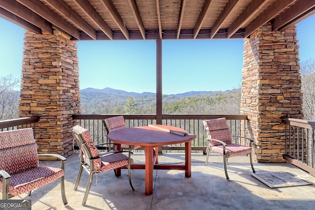 view of patio / terrace featuring a mountain view