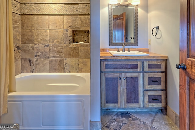 bathroom featuring vanity and a tub to relax in