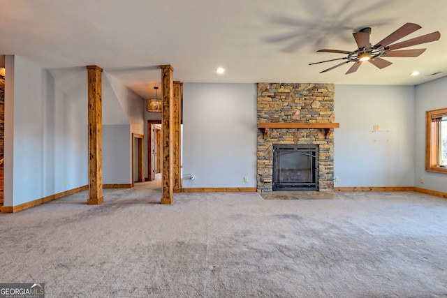 unfurnished living room featuring a fireplace, ceiling fan, and carpet flooring