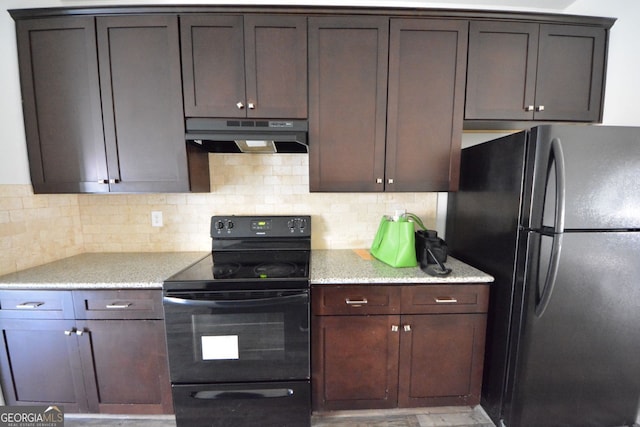 kitchen featuring refrigerator, decorative backsplash, electric range, light stone countertops, and dark brown cabinets