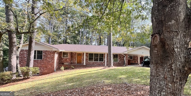 ranch-style house with a front lawn and a carport