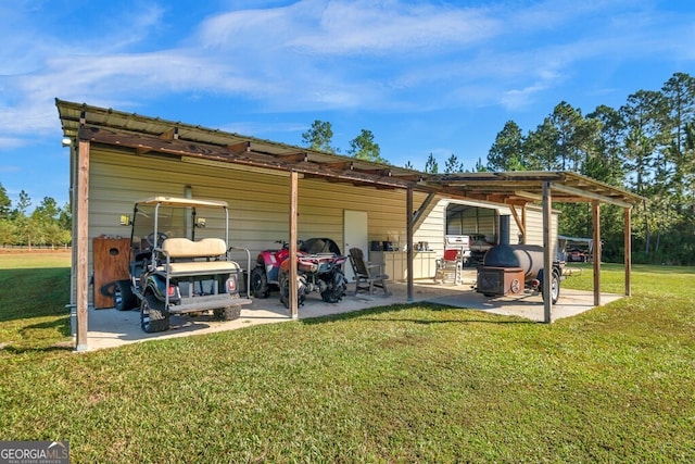 back of property featuring a lawn and a patio