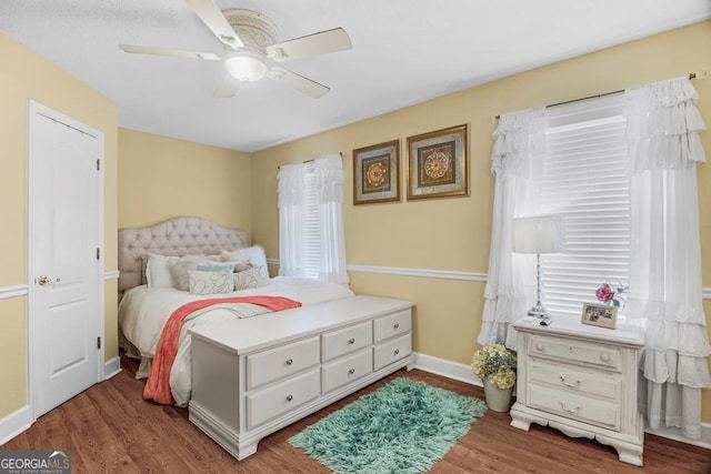 bedroom featuring hardwood / wood-style flooring and ceiling fan